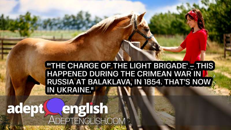 A photograph of a beautiful horse and young lady in red. As we talk about the common English word charge and its many meanings.