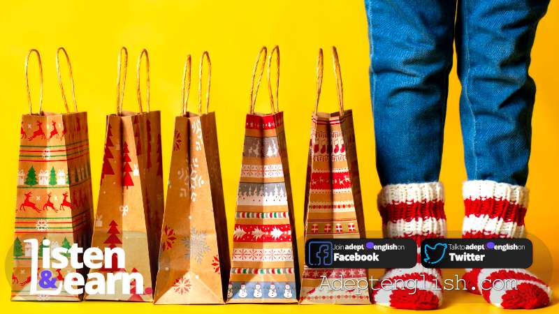 A photograph of gift bags lined up and a child's legs. Common English words that will help you share ideas and have conversations at Christmas.