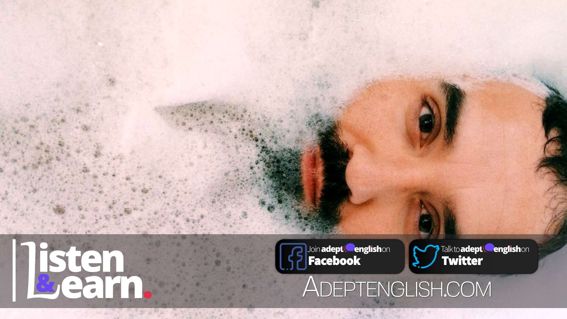 A bearded man in a bath surrounded with bubbles. Archimedes supposedly had his eureka moment in a bath.