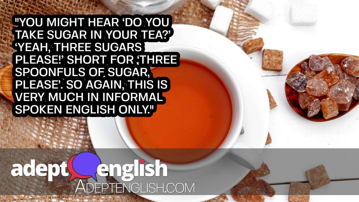 A photograph of a cup of tea with lots of sugar cubes around it. English grammar and uncountable-nouns in todays English lesson.