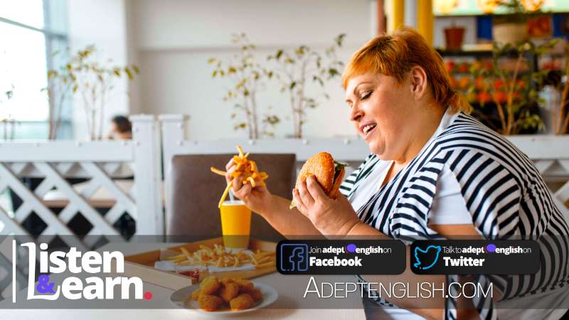 A photograph of a lady eating fast food. Let's practice listening to English language spoken natively and learning about intermittent fasting at the same time.