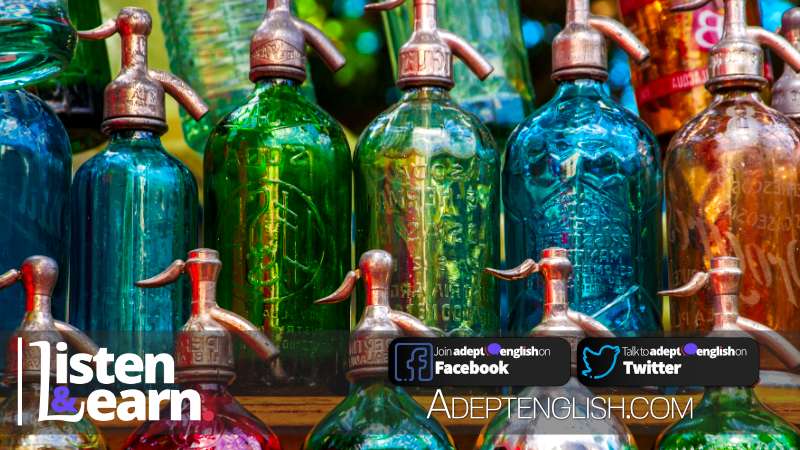 A photograph of colourful vintage soda bottles, an example of antiques, in this English listening practice lesson.