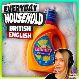 A bright orange laundry liquid bottle floating on soap suds. Fluent British English at Home.