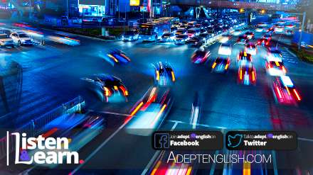 A slow shutter photograph of busy traffic at night. Used in a native English spoken podcast on UK smart motorways.