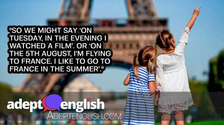 A photograph of little girls in Paris, in the background the Eiffel tower, during summer vacation. Used To help explain English prepositions in and on.