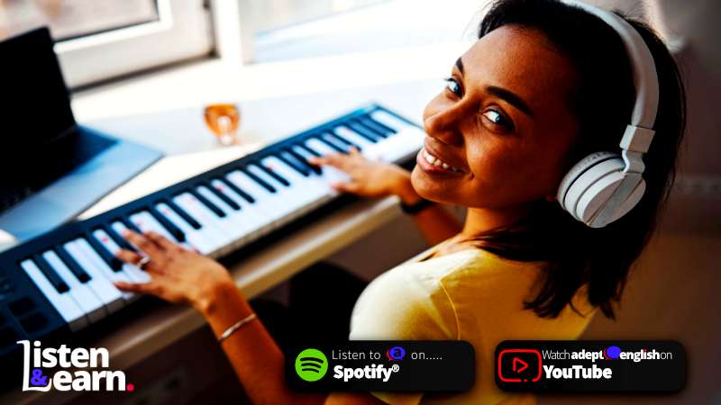 A photo of a young lady wearing headphones, playing the piano. Dive into English through the rhythm of music! Unleash a fresh, fun way to learn!
