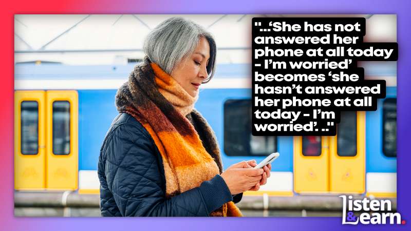 A lady looking at her phone in a train station. In this lesson, you'll learn why it's important and how to pronounce negative contractions correctly.